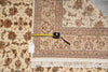 Load image into Gallery viewer, Decorative rug with a measuring tape on top, showing dimensions.