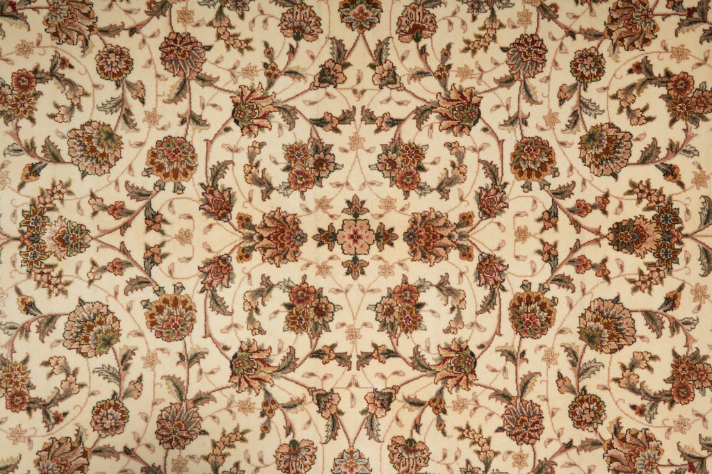Close-up of a patterned fabric with floral designs on a beige background