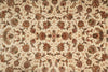 Load image into Gallery viewer, Close-up of a patterned fabric with floral designs on a beige background