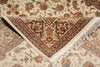 Load image into Gallery viewer, Close-up of a patterned rug with intricate designs and fringes.