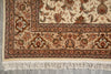 Load image into Gallery viewer, Close-up of a patterned rug with intricate designs on a neutral background