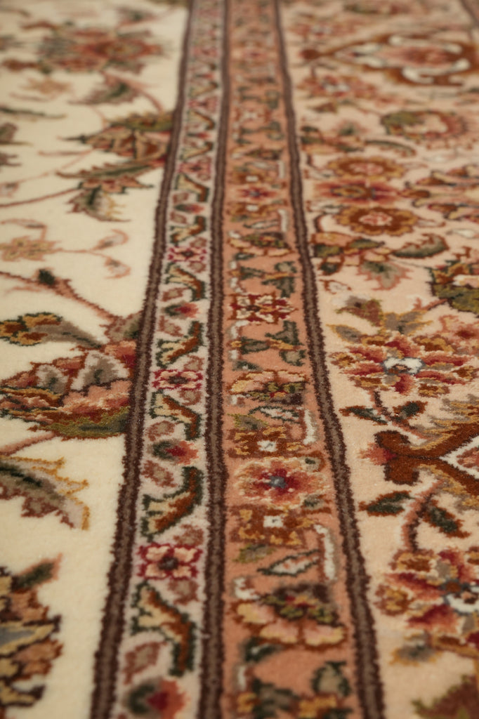 Close-up of a patterned fabric with intricate designs and colors.