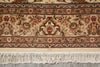 Load image into Gallery viewer, Close-up of a patterned rug with fringes on a neutral background