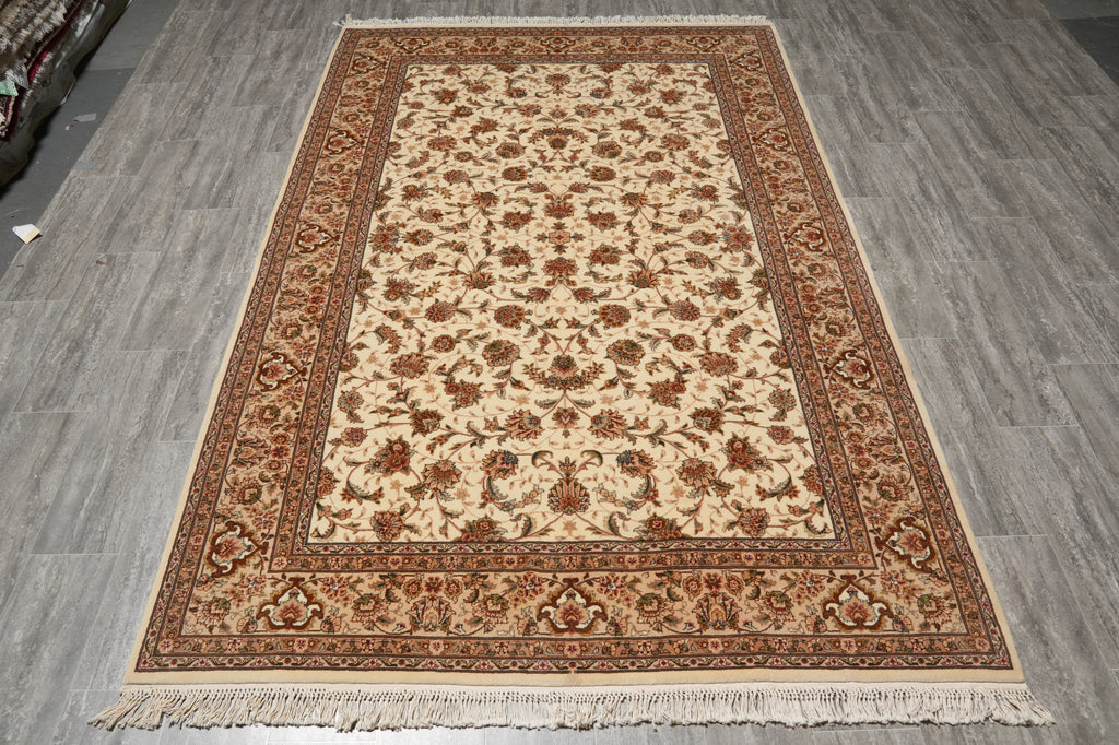 Decorative rug with intricate patterns on a wooden floor