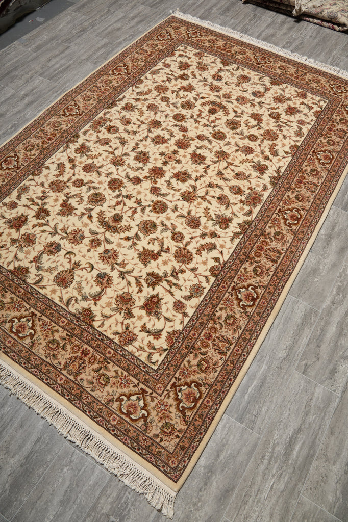 Decorative rug with intricate patterns on a wooden floor