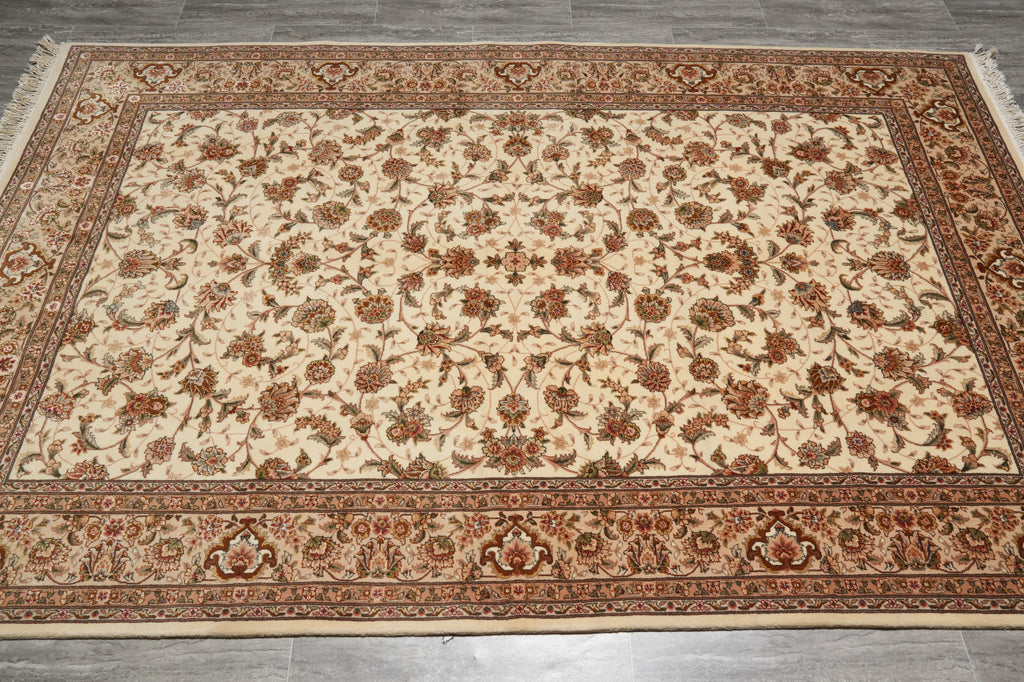 Decorative rug with intricate patterns on a wooden floor