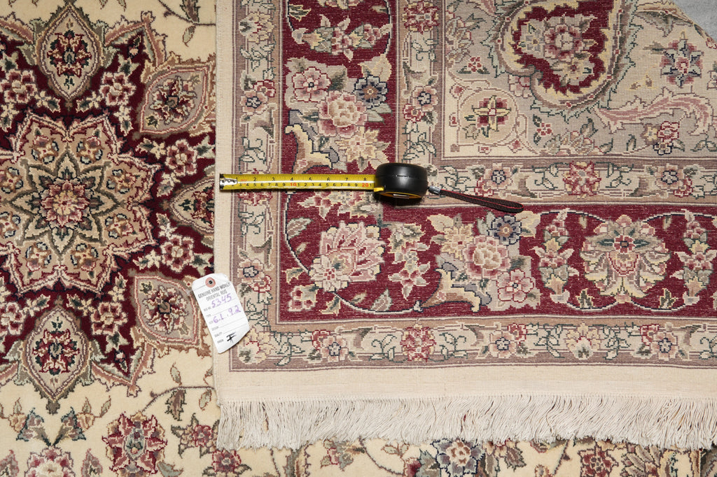 Decorative rug with a measuring tape and price tag on a plain background