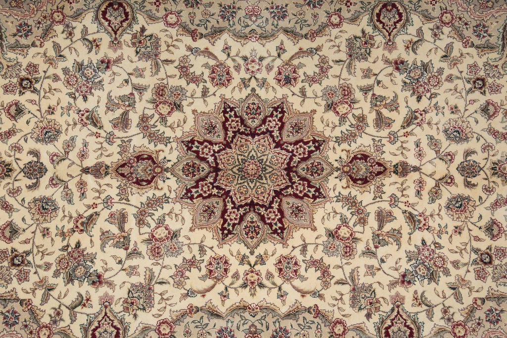 Close-up of a patterned rug with intricate designs on a beige background