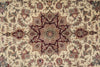 Load image into Gallery viewer, Close-up of a patterned rug with intricate designs on a beige background