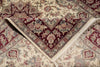Load image into Gallery viewer, Close-up of an intricately patterned rug with red and beige colors.