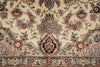 Load image into Gallery viewer, Close-up of a patterned rug with floral and paisley designs.