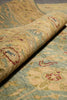 Load image into Gallery viewer, Close-up of a patterned rug with intricate designs.