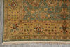 Load image into Gallery viewer, Close-up of a patterned rug with intricate designs on a gray floor.