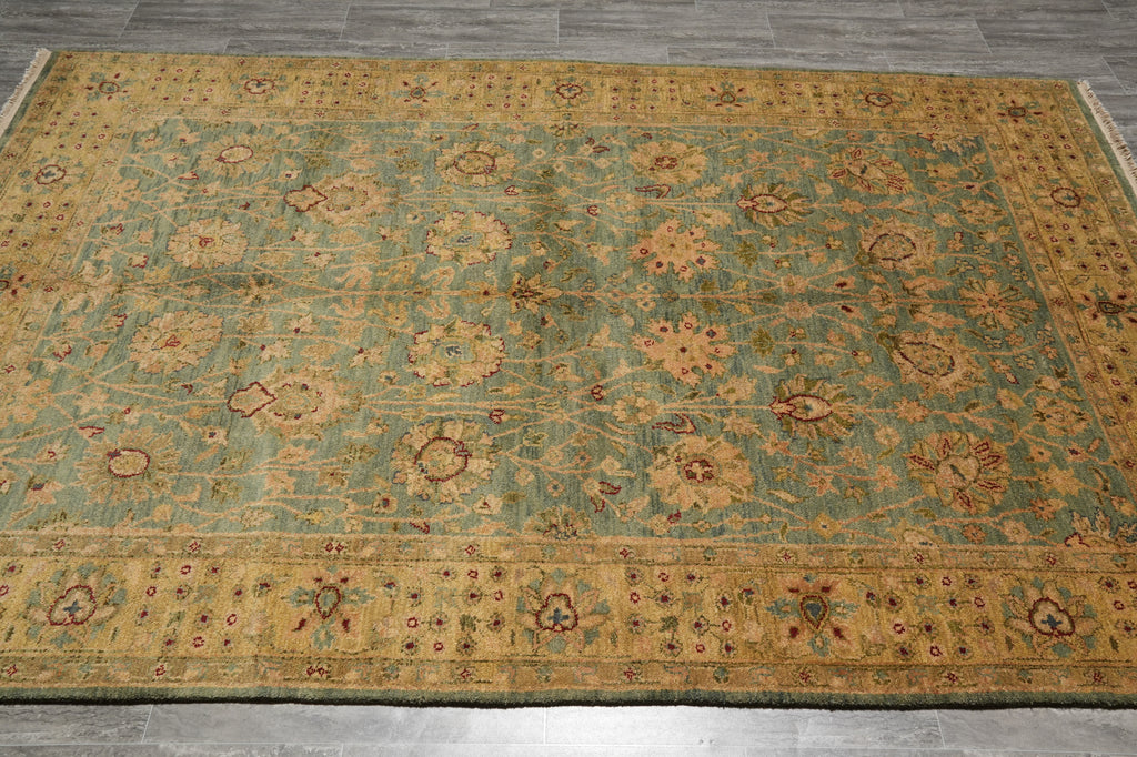 Decorative rug with floral patterns on a wooden floor
