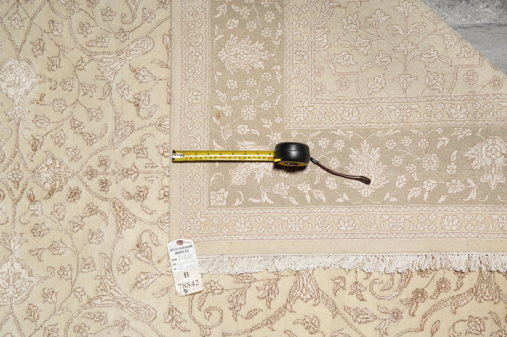 Patterned fabric with a measuring tape and label on a flat surface
