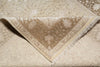 Load image into Gallery viewer, Close-up of a beige and brown patterned rug with intricate designs.