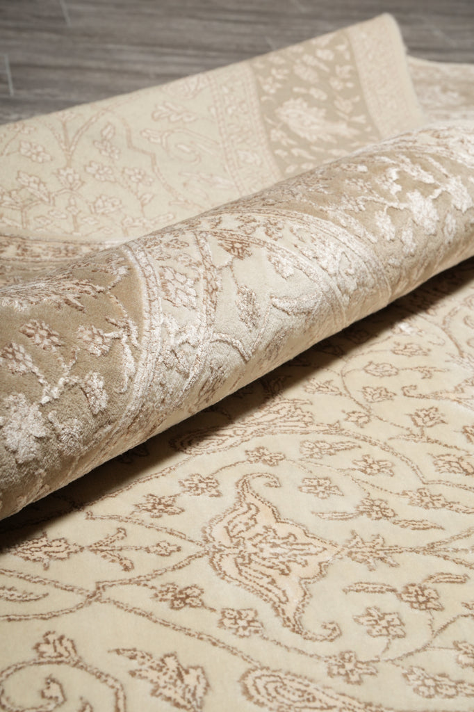 Close-up of textured fabric with intricate patterns on a wooden surface