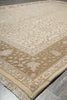 Load image into Gallery viewer, Patterned beige and white rug on a gray floor
