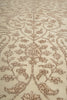 Load image into Gallery viewer, Close-up of a patterned rug with intricate designs on a beige background
