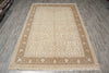 Load image into Gallery viewer, Beige patterned rug on a wooden floor