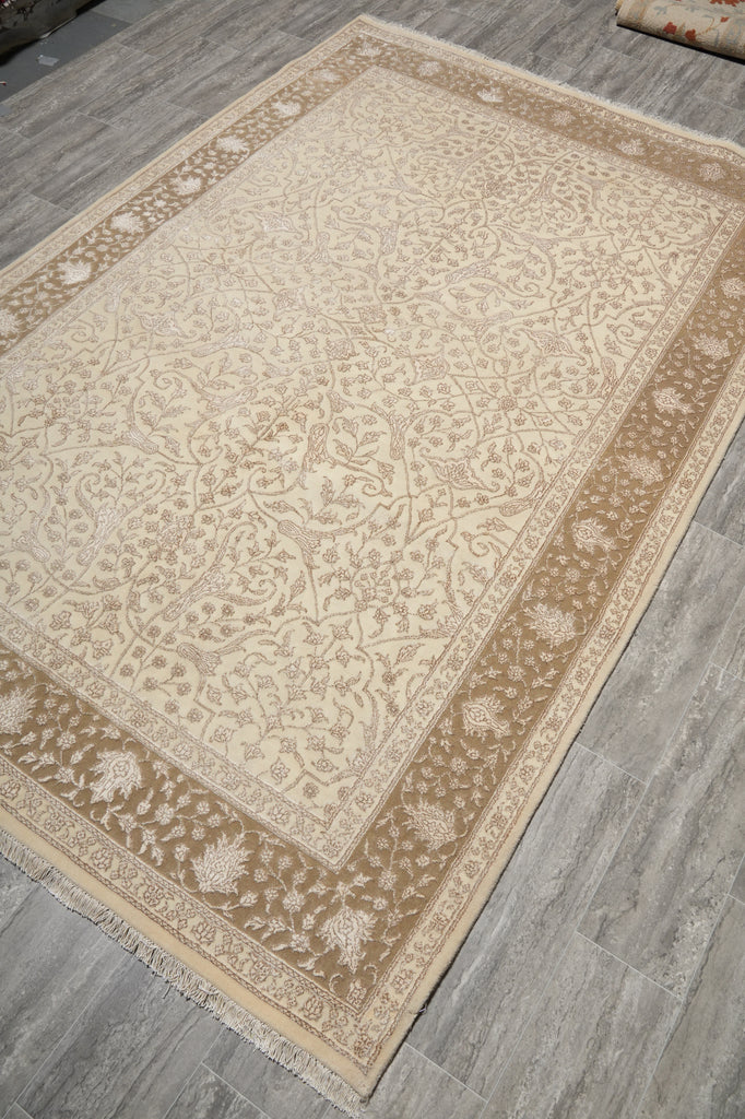 Beige patterned rug on a wooden floor
