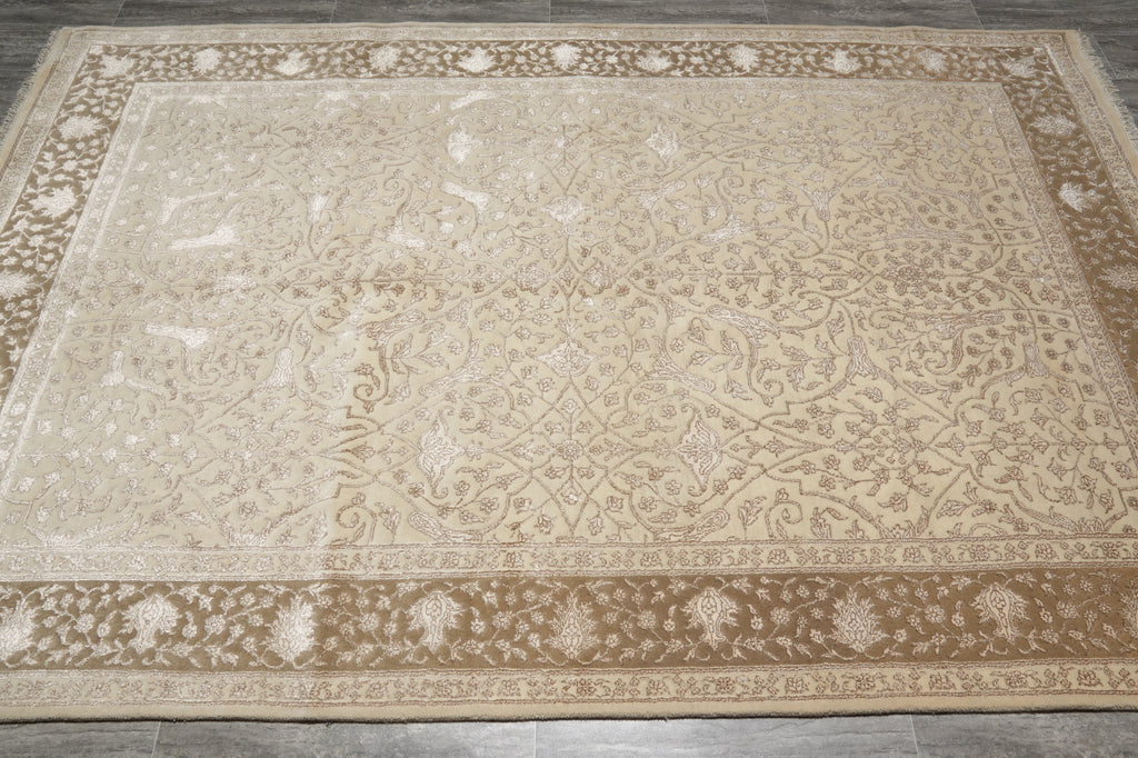 Beige patterned rug on a wooden floor