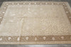 Load image into Gallery viewer, Beige patterned rug on a wooden floor