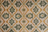 Load image into Gallery viewer, Patterned fabric with geometric design in green, orange, and beige.
