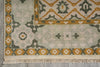 Load image into Gallery viewer, Close-up of a patterned rug with geometric designs on a gray surface