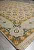 Load image into Gallery viewer, Close-up of a patterned rug with geometric design on a gray floor.