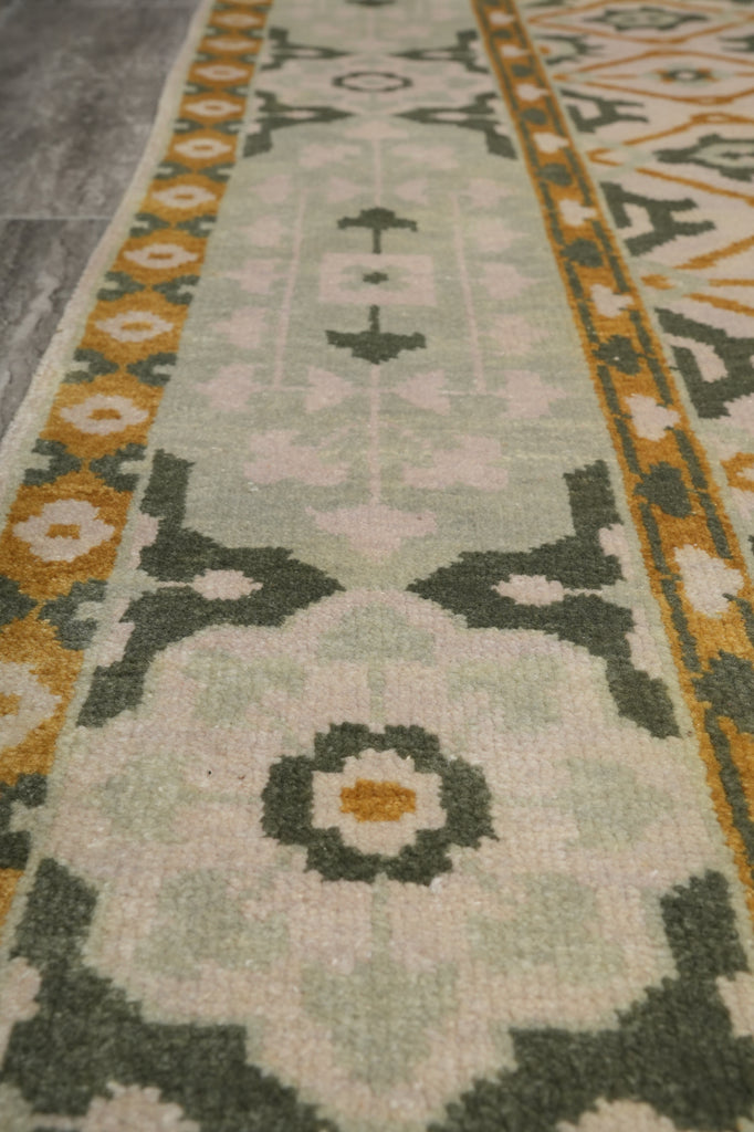 Close-up of a patterned rug with geometric designs.