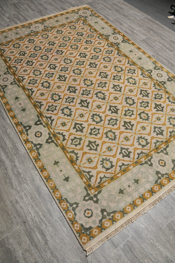 Decorative rug with geometric pattern on a wooden floor