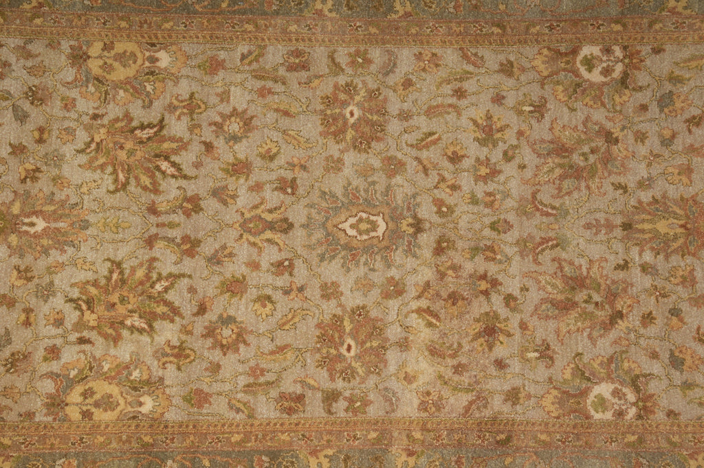 Close-up of an ornate rug with intricate patterns on a beige background