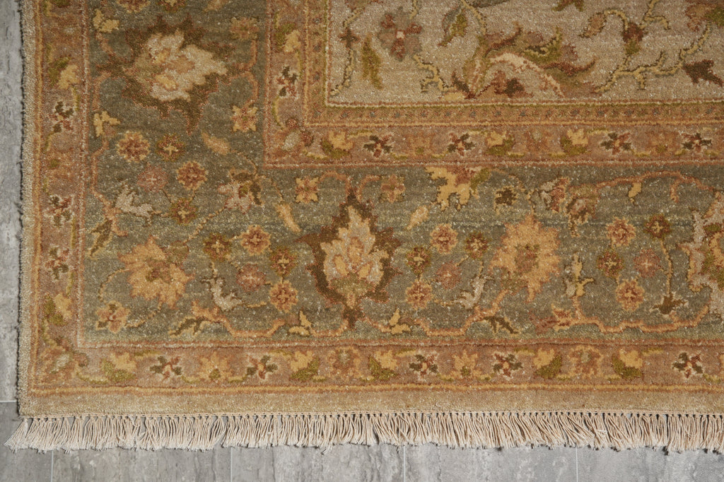 Decorative rug with intricate patterns on a gray floor