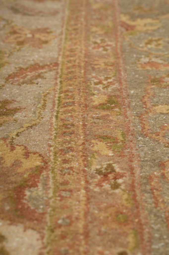 Close-up of a textured fabric with intricate patterns and colors.