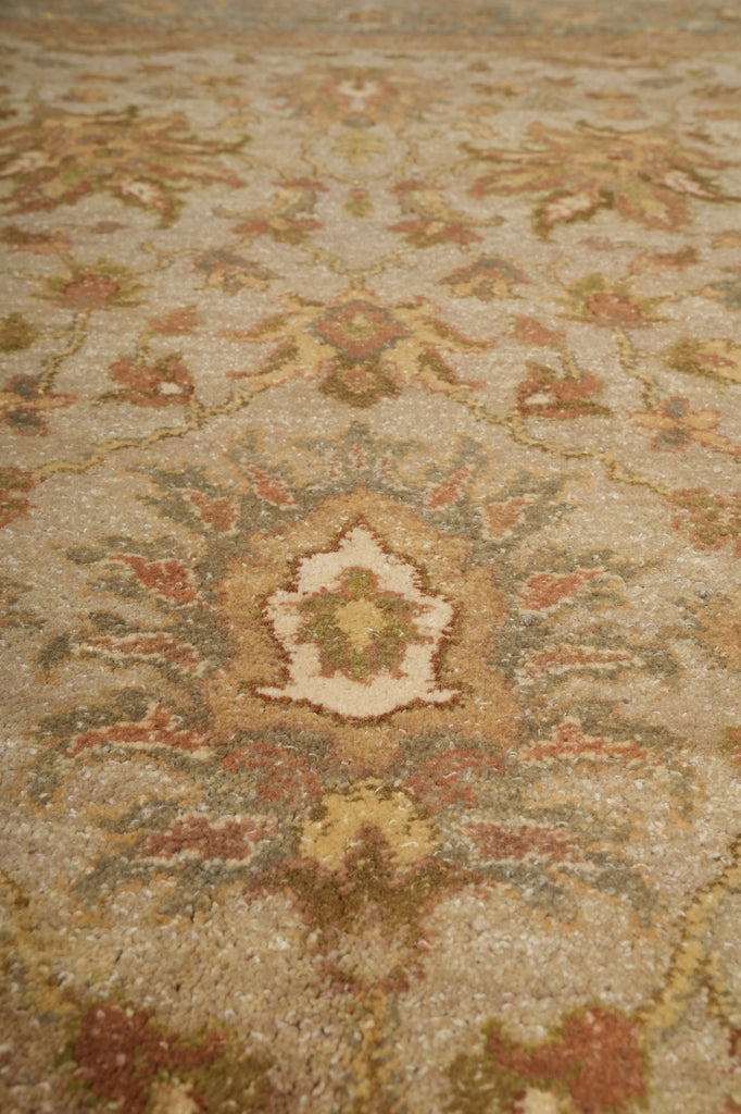Close-up of a patterned rug with earthy tones