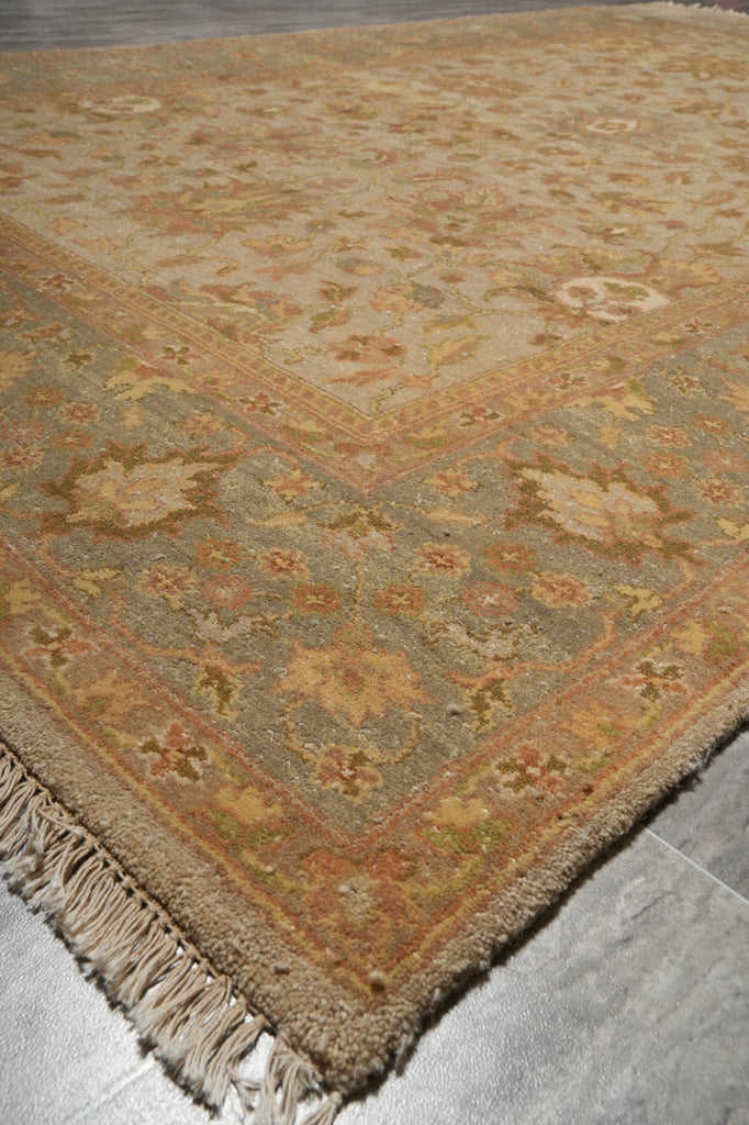 Decorative rug with intricate patterns on a wooden floor