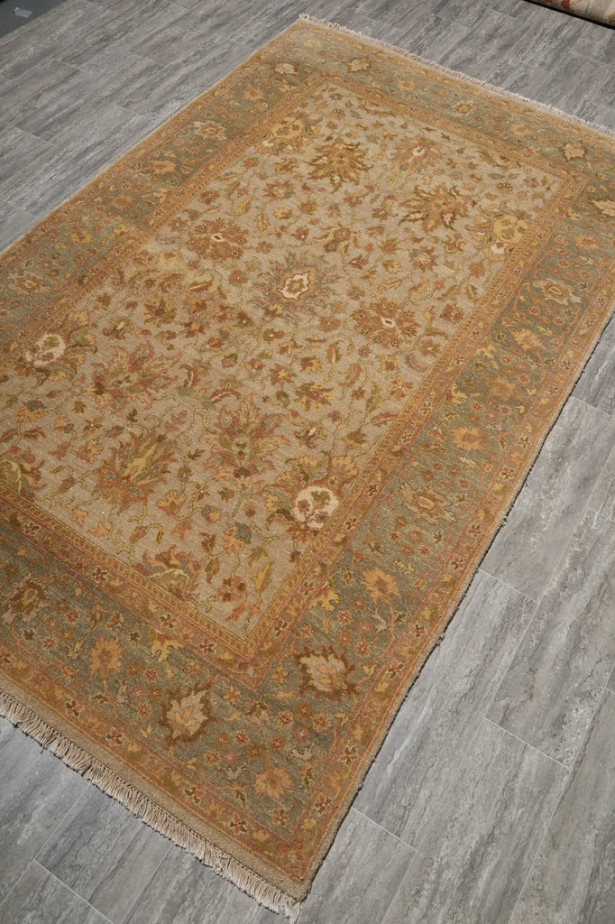 Decorative rug with intricate patterns on a wooden floor