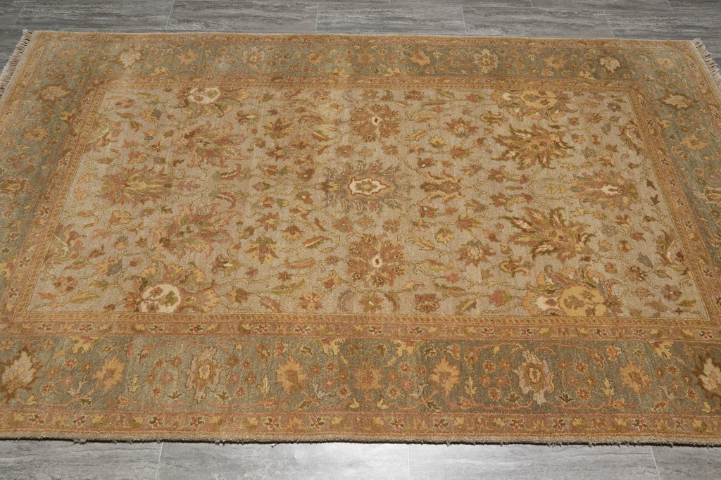Decorative rug with intricate patterns on a wooden floor