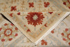 Load image into Gallery viewer, Close-up of a patterned rug with red and beige colors