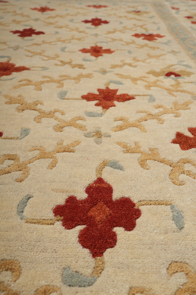 Close-up of a patterned rug with red and beige designs