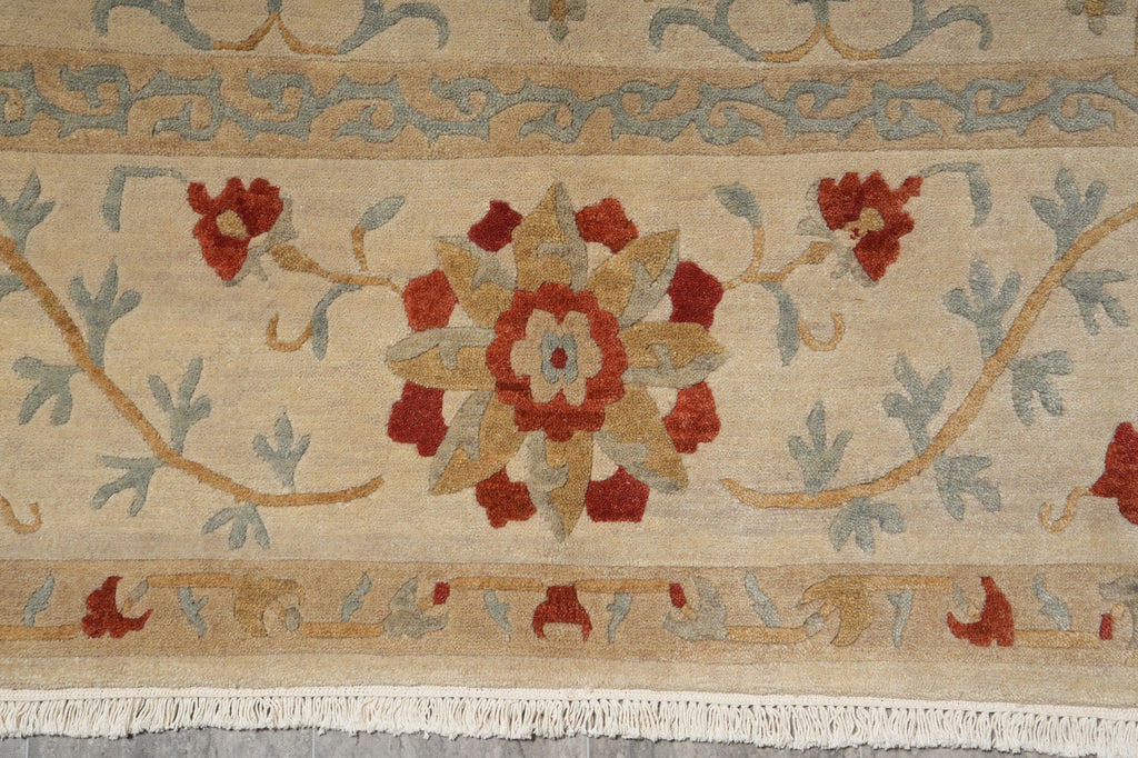 Close-up of a patterned rug with floral design and beige background