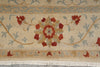 Load image into Gallery viewer, Close-up of a patterned rug with floral design and beige background