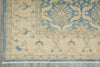 Load image into Gallery viewer, Close-up of a patterned rug with blue and beige colors on a wooden floor.