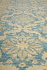 Load image into Gallery viewer, Close-up of a patterned rug with blue and beige colors