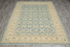 Load image into Gallery viewer, Beige and blue patterned rug on a wooden floor