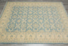 Load image into Gallery viewer, Patterned rug on a wooden floor