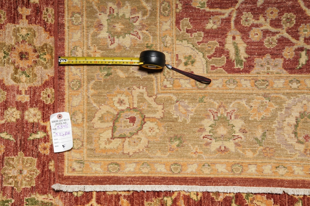 Decorative rug with a measuring tape on top, showing dimensions.
