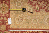 Load image into Gallery viewer, Decorative rug with a measuring tape on top, showing dimensions.
