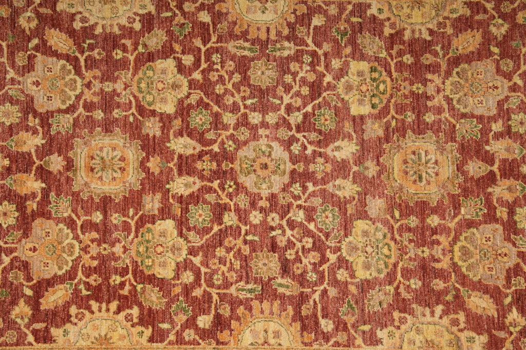 Close-up of a patterned red rug with intricate designs